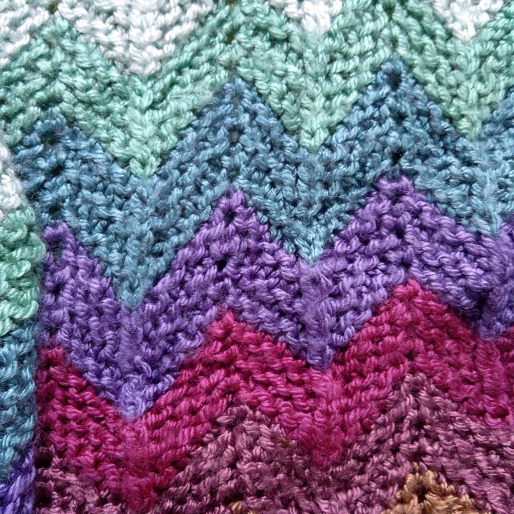 close view of the knitted garter-stitch chevron stripe knitting pattern