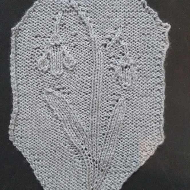 knitted swatch of snowdrop with stem and leaves